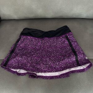 Cute purple white black lululemon skirt with black shorts under